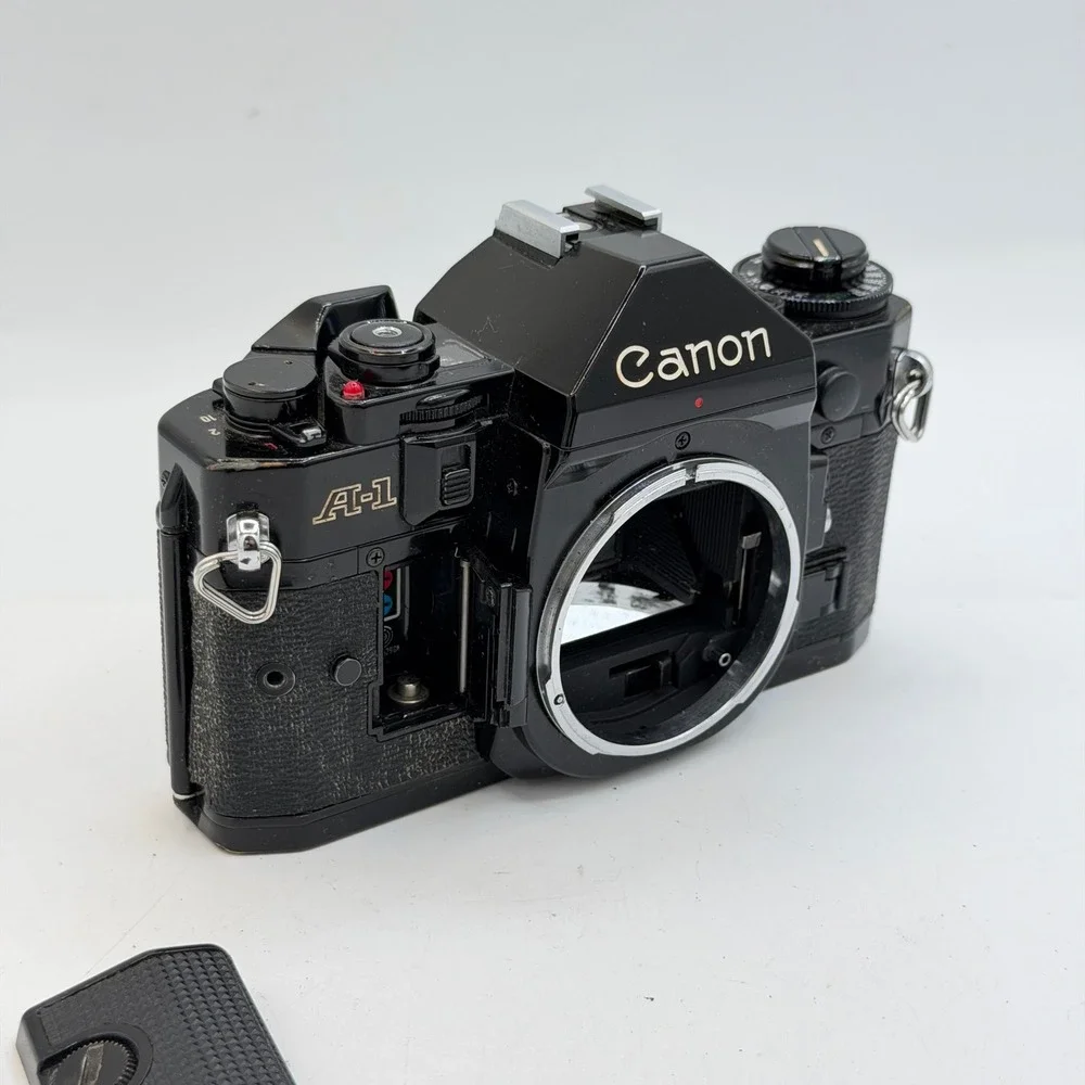 Lot of 2 Canon A-1 35mm SLR Film Camera Body Black Vintage Tested - For Parts